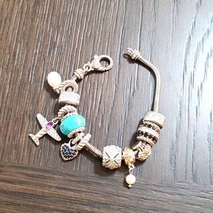 Judith Ripka 925 SS charm bracelet with charms included